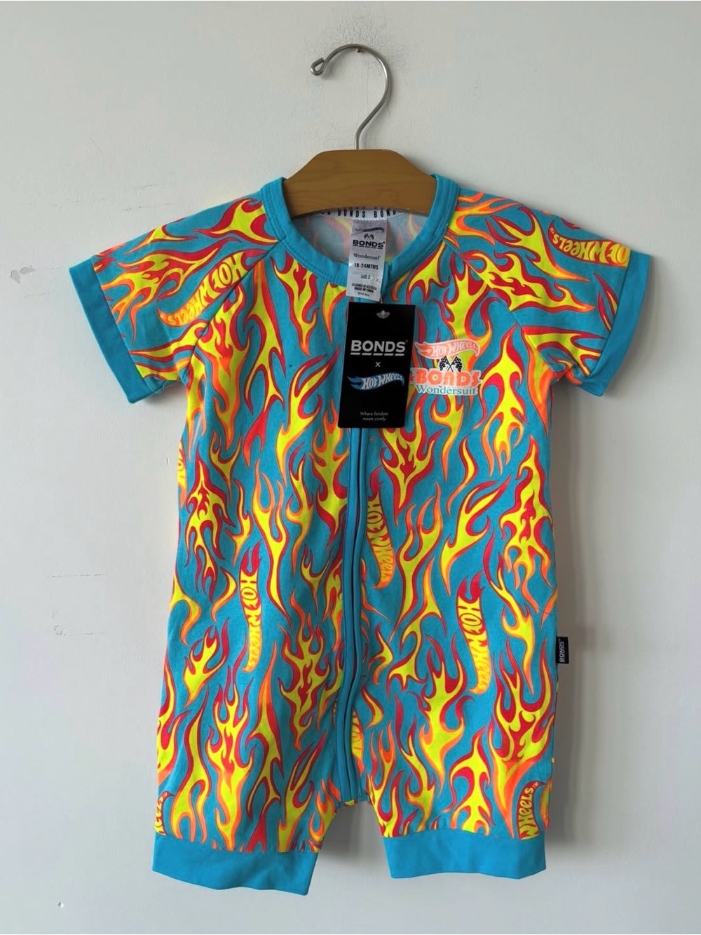RARE bonds romper in a Turquoise with Yellow & Red Flame Print